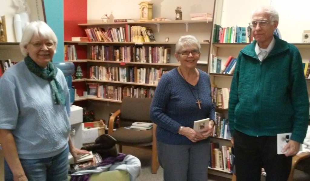 Sue (center) & Tom and Mary Ellen caught conspiring in the Book Room.  Tom and Mary Ellen worked tirelessly in this little room for 3 months to prepare it for Sue to take over (see entire story on our Blog, February 3, 2017).  Sue continues to come in several times during the week to keep the books organized and also update the displays for the upcoming holidays.  She also helps with customers and blesses all who have the privilege of meeting her.  Often, people will sit in the Book Room and visit with her, sharing their faith and prayer requests.  These are precious people!!!  